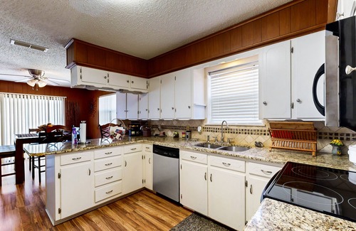 Kemp House | Lakefront retreat near golf course with serene wraparound deck, fireplace, & AC