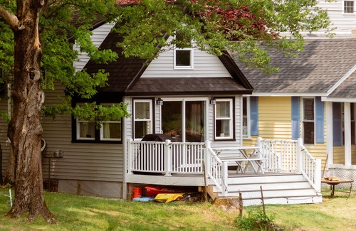 Westminster Cottage | Lakefront; view of ski mountain, firepit, dock, kayaks, paddle board