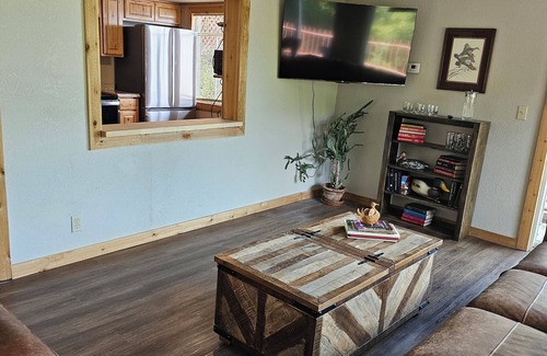 Tia Juana Cabin | Lakeside, boat dock and hot tub with this snug small cabin.