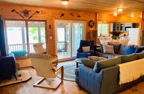 The Bays Cabin | Lakeside home with private dock, firepit, grill, scenic balcony, fireplace & AC