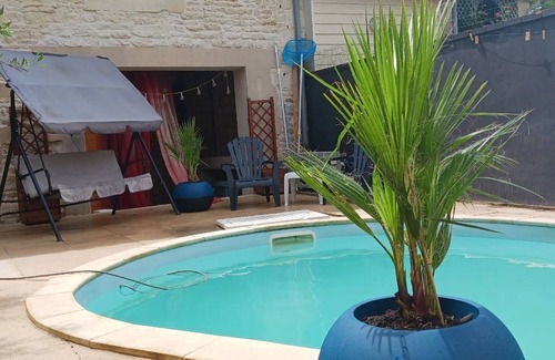 Chef-Boutonne Bed & Breakfast | Large guest room with bed and sofa bed