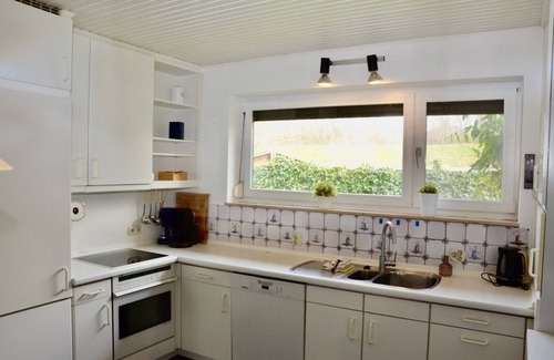 Rustersiel House | Large holiday home on the dike with a winter garden, garden and terrace