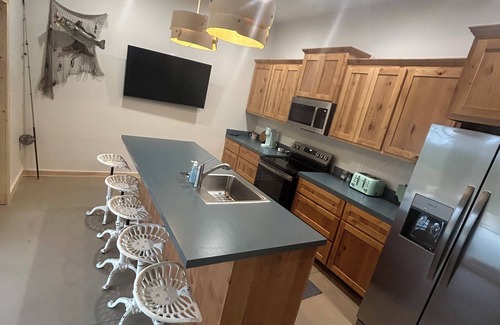 Mannford Apartment | Large porch offers beautiful views of the lake. Enjoy unique interior design!