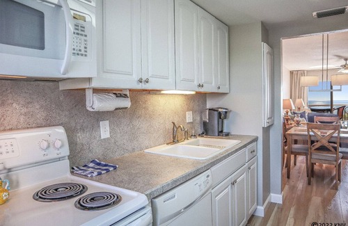 South Island Condo | Leonardo Arms 529 Beachfront 2B/2B Vacation Condo! Palm Trees And Sunshine!