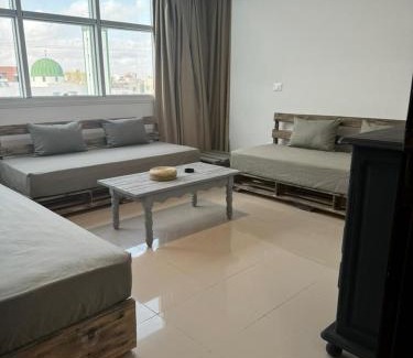 Sfax Apartment | Les portes grisées