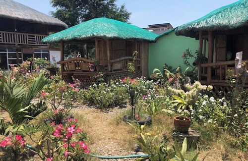 Bacnotan Cottage | Local style cottage in a garden setting - cosy comfort with A/C