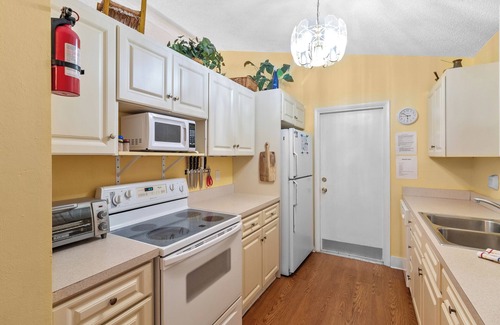 Gardens of Gulf Cove House | Located in an active community w/heated pools, tennis courts and shuffleboard