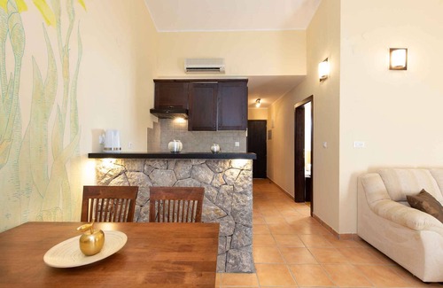 Brzac Apartment | Lotus Resort vacation apartment with swimming pools and garden as well as children's playground and parking lot surrounded by greenery and forest