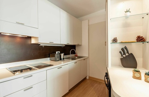 Santa Giulia Apartment | Lovely apartment for 4 guests with A/C, pool, WIFI, TV, patio and parking