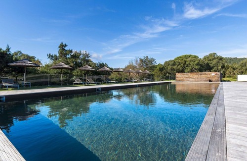 Santa Giulia Apartment | Lovely apartment for 4 guests with A/C, pool, WIFI, TV, patio and parking