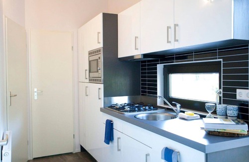 Noordoostelijk van Schaarsbergen House | Lovely apartment in villa for 4 guests with WIFI, pool, TV and terrace