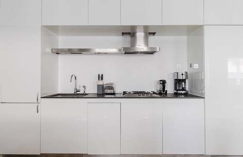 Central New York City Apartment | Lovely Midtown 2BR, Gym, Rooftop, W/D, Doorman, by Blueground
