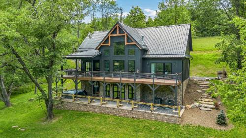 Lansing House | Lux Riverfront Retreat- Hot Tub, Game Room, Views!