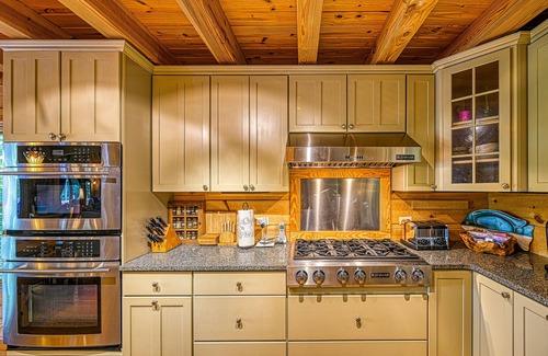 Bumpass Cabin | Luxurious lakefront cabin with hot tub, game room, & washer/dryer- dog friendly