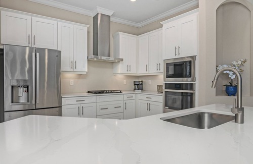 Biggar House | Luxury Lakefront 4-Bedroom Home with Private Pool and Resort Amenities in Estero