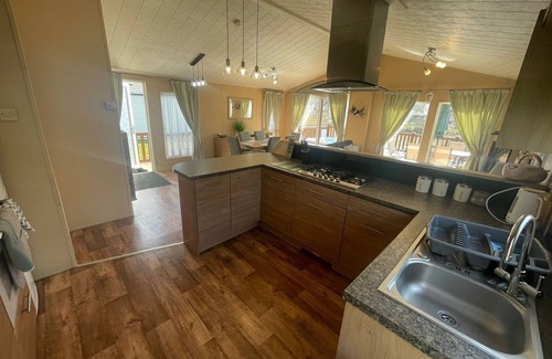 Tattershall Cabin | luxury lakeside lodge with a sunken hot tub on bull rush a peaceful feature lake @Tattershall lakes