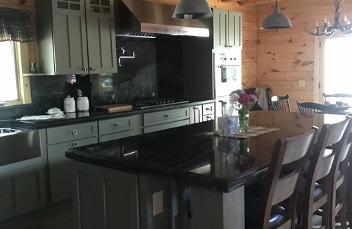 Meredith Cabin | Luxury Log home steps from private beach in Meredith on Lake Winnipesaukee.