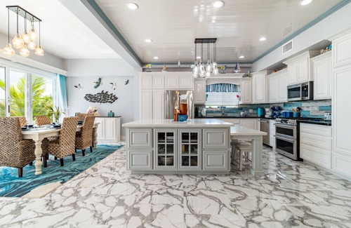 San Pedro House | Luxury Oasis: Serene Beachfront with Pool & Dock