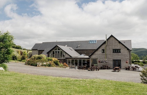 Devils Bridge House | Luxury renovated barn with a large hot tub and games room. Sleeping 16