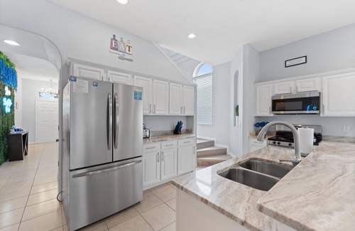 Sunrise Lakes House | Luxury Stay Near Disney Private Pool Hot Tub & EV Charger at Blissful Blue Oasis