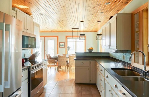 Clinton House | Luxury Water View Home With 2 Living Spaces, Hot Tub & Access To River