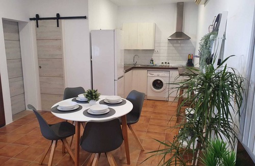Chiclana de la Frontera House | Minichalet Jacaranda with swimming pool, garden and barbecue.