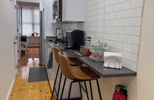 Upper Manhattan Apartment | Modern 1-bedroom Garden Apartment with Backyard, up to 25 mins to Times Square