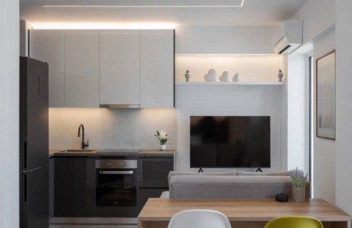 Vouliagmeni Villa | Modern Athens Apartment | Apartment Luxe | 1 Bedroom | Balcony with Garden.