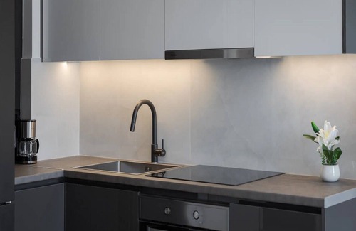Vouliagmeni Villa | Modern Athens Apartment | Apartment Luxe | 1 Bedroom | Balcony with Garden.