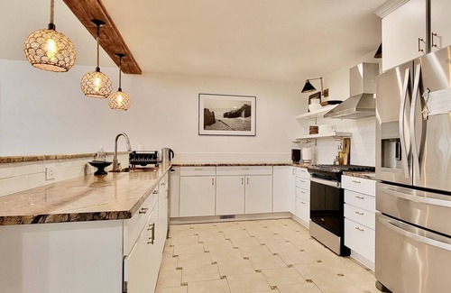 Paw Paw Lake House | Modern cottage w/sauna, fire pit, outdoor dining, pool table, & sunroom