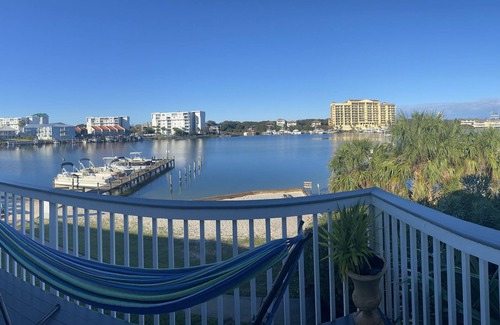 Holiday Isle Condo | Modern condo on Harbor & steps from the beach! W/Private balcony & Boat Slip