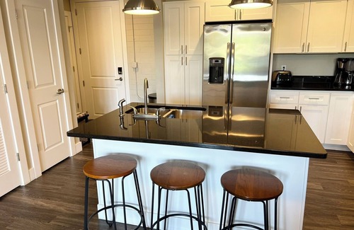 Manistee Condo | Modern condo on Manistee River just steps away from downtown!
