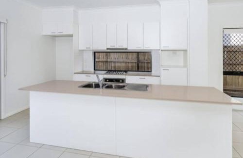 Mango Hill House | Modern Elegance Near Lakes Train Parks and Beaches