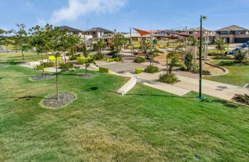 Mango Hill House | Modern Elegance Near Lakes Train Parks and Beaches