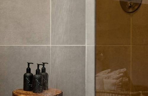East Bank Hotel | Modern Hideaway with Rooftop Lounge, Pool, Firepits & City Views