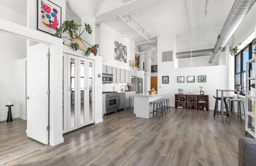 University Village / Little Italy Condo | Modern Historic Loft 19ft Ceilings, Gym, Heated Parking, Skyline Views + Balcony