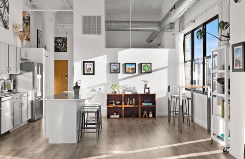 University Village / Little Italy Condo | Modern Historic Loft 19ft Ceilings, Gym, Heated Parking, Skyline Views + Balcony