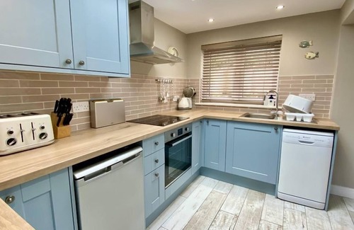 Treator House | Modern holiday home in Padstow Old Town with parking and patio garden