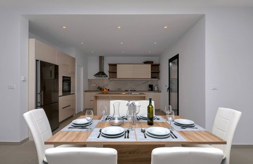 Bast House | Modern holiday home with infinity pool, three bedrooms, terrace, sea view