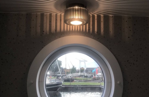 Stavoren Boat Rental | Modern houseboat in quiet harbor close to the IJsselmeer with SUPs and canoe