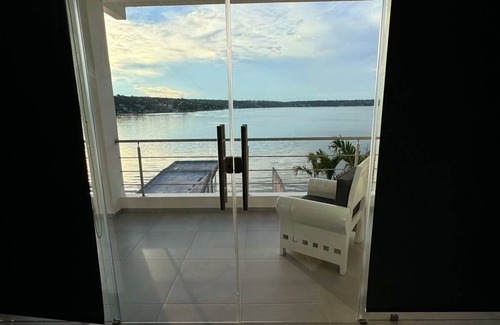Tequesquitengo House | Modern Lakeside Retreat: Beach Access, All-White Tile, & Stylish Décor