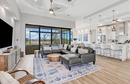 Burnt Store House | Modern & Luxurious Waterfront! Outdoor Space w/Heated Pool/Spa! Over $125 of Free Daily Activities!