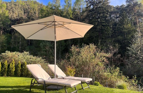 Sant'Andrea in Monte Apartment | modern, luxury, private entrance, garden, terrace, and stunning mountain views.