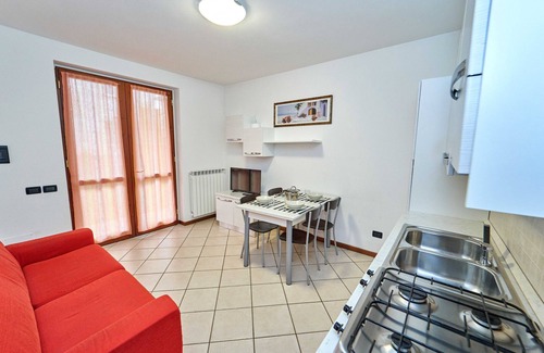 Curno Apartment | Modern one-bedroom apartment near the hospital, with large garden and equipped with washing machine