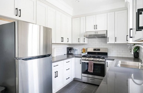 Azusa House | Modern Space Hideaway : w/2 King Beds, 2 Baths, Full Kitchen, a Pull-Out Sofa, with Backyard Patio and Gated Parking.