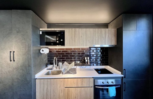 Downtown Santiago Apartment | Modern Studio Apartment, Terrace & Workspace with Panoramic Views