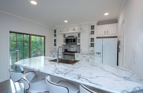 Galloway House | Modern waterfront fireplace in bedroom/bath jetted tub walk in shower no steps