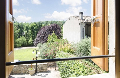 Monzambano House | Monzambano: House with garden and panoramic loggia with fireplace for barbecue