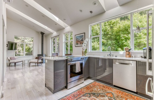 Stevenson House | Mountain and river-view home + studio with fireplace, grills, outdoor areas