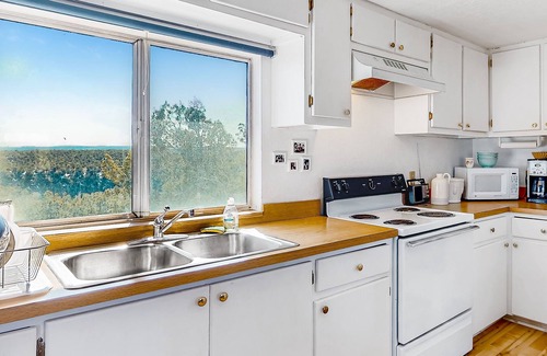 Marvel House | Mountain view home with pool, covered patio, & fireplace - secluded location